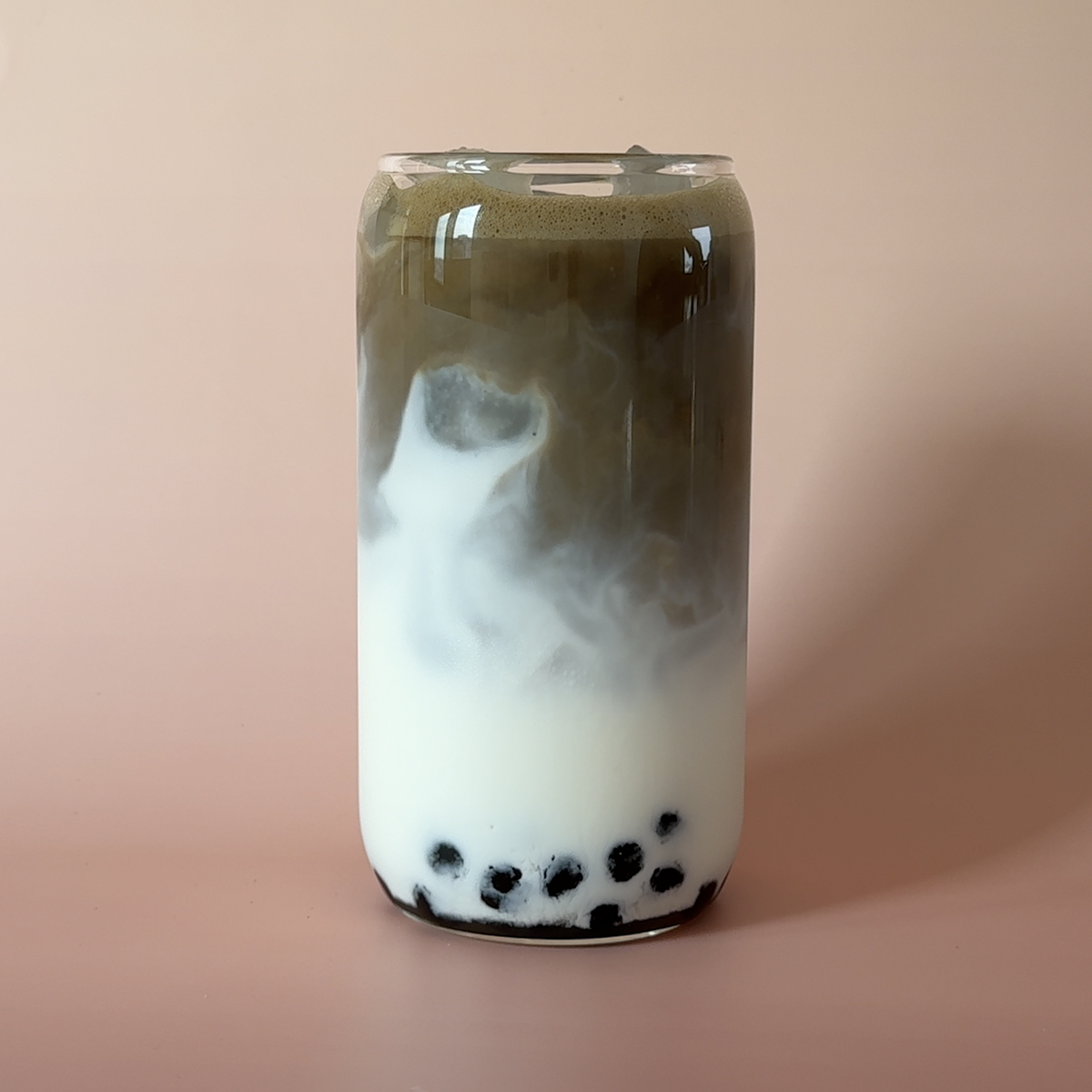 Iced Honey Orchid milk tea with boba pearls made from whole-leaf oolong tea powder