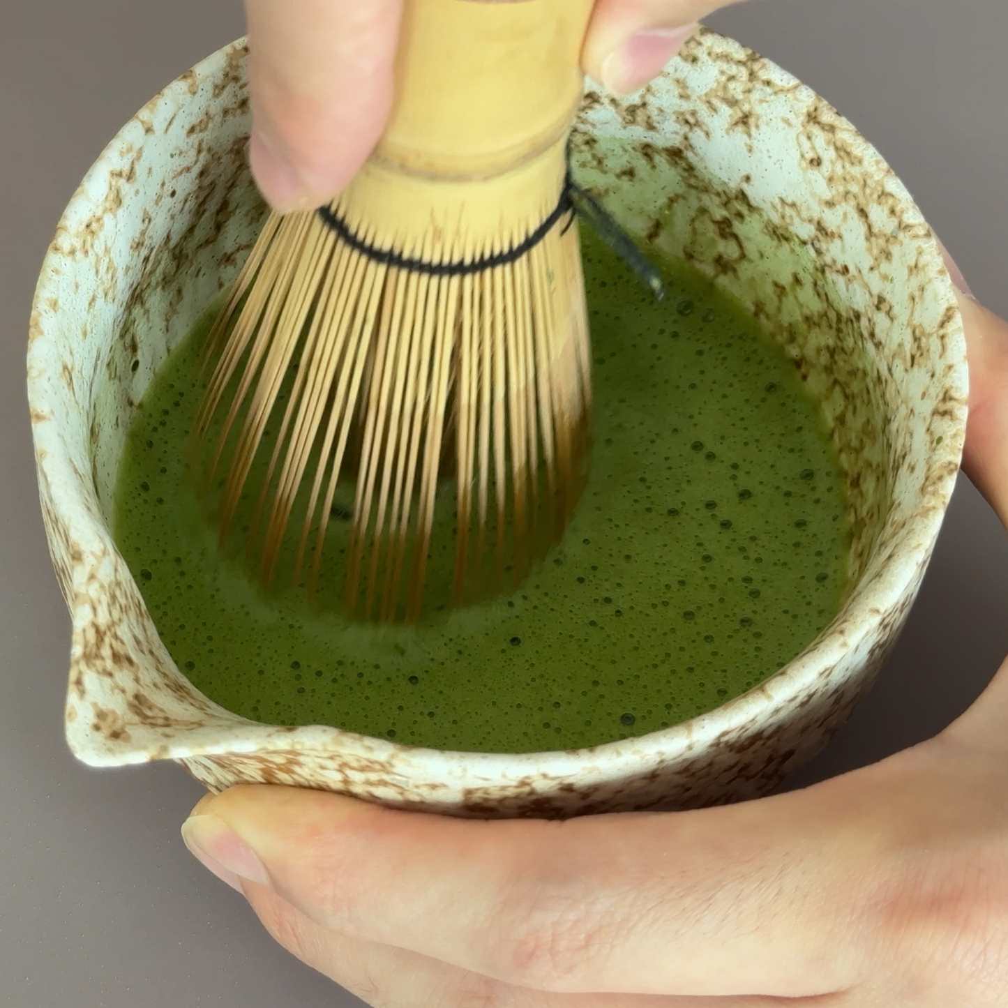 Whisking Guizhou ceremonial matcha into a smooth, frothy bowl