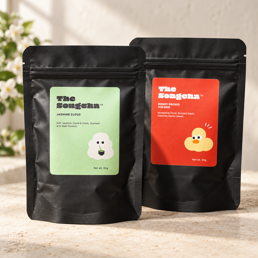 Honey Orchid oolong and jasmine green tea powders side by side, finely milled