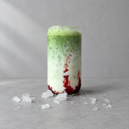 A strawberry matcha latte made with ceremonial-grade single-origin Guizhou matcha, layered with strawberry and milk over ice